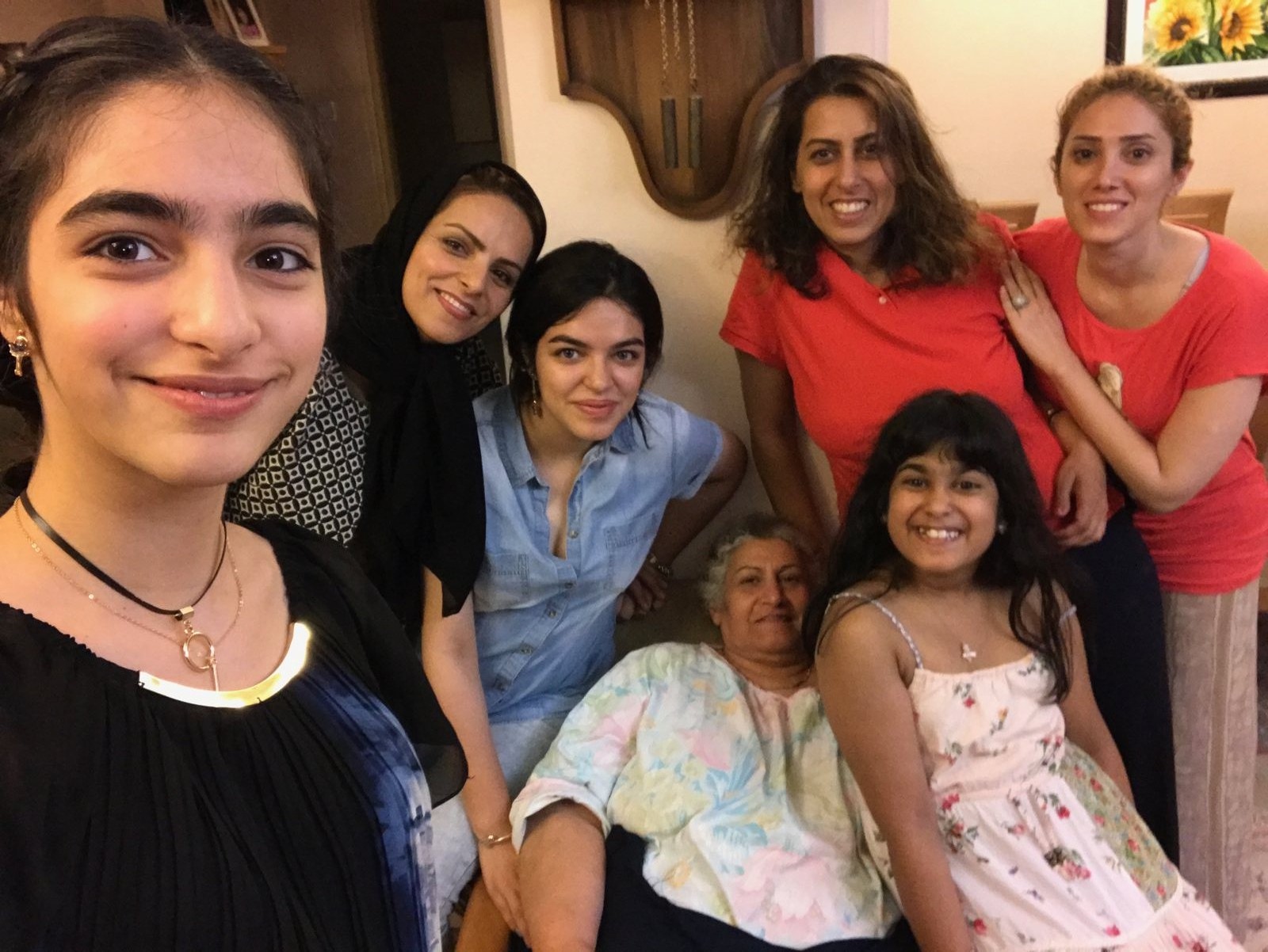 Nika with family and friends gathered together